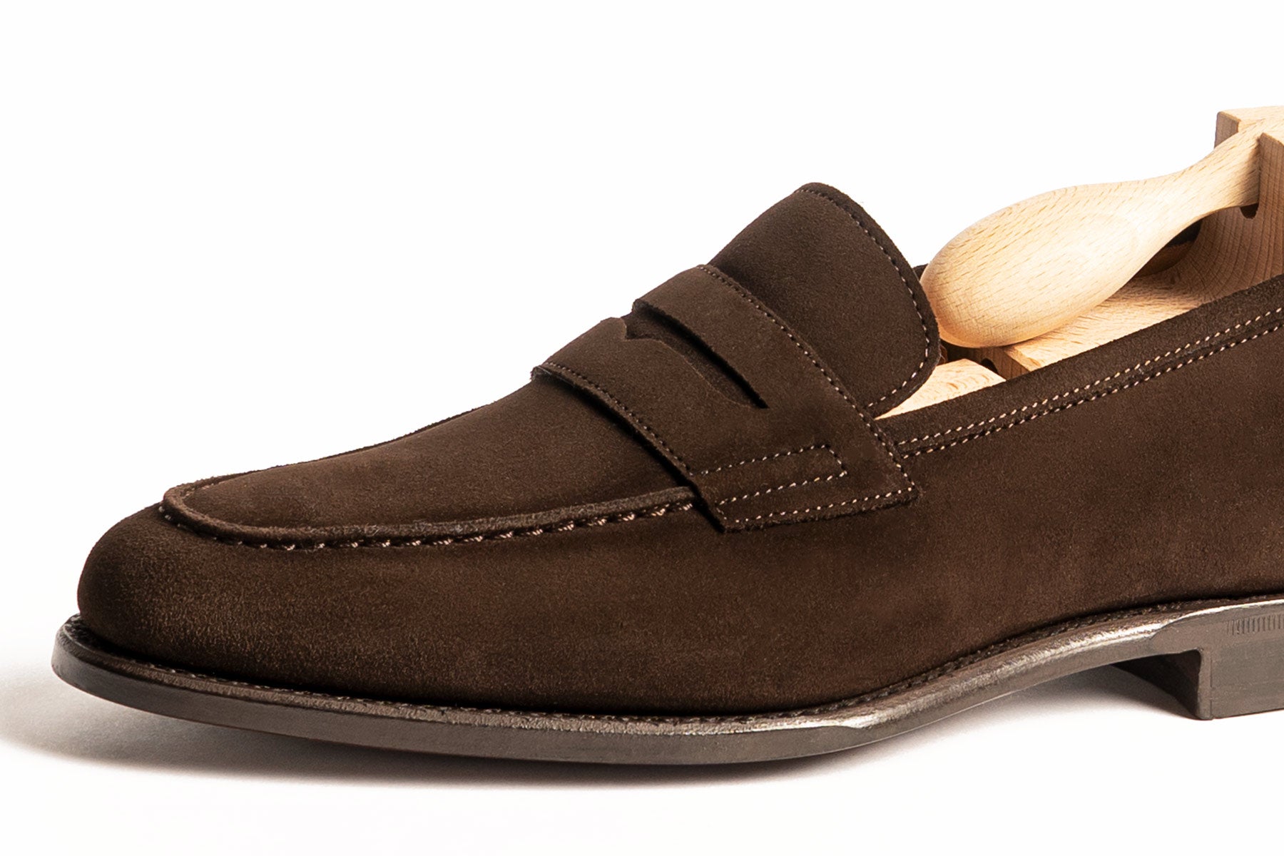 Carlos Santos 9176 Elliot unlined dark brown suede penny loafers with Goodyear welted leather sole on display.