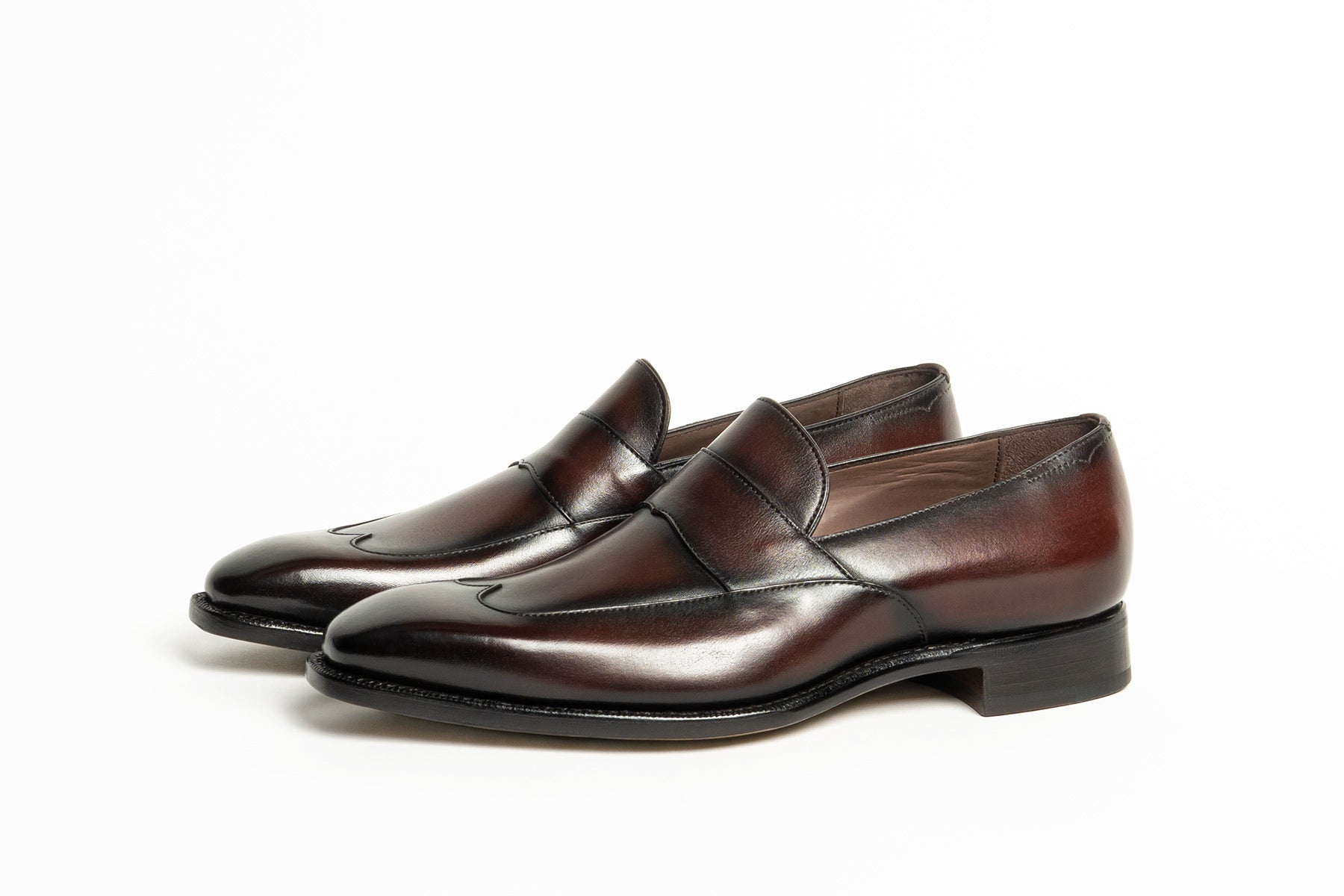 Carlos Santos CS113 Handgrade Austerity Brogue Penny Loafers in Bordo Shadow Patina on white background