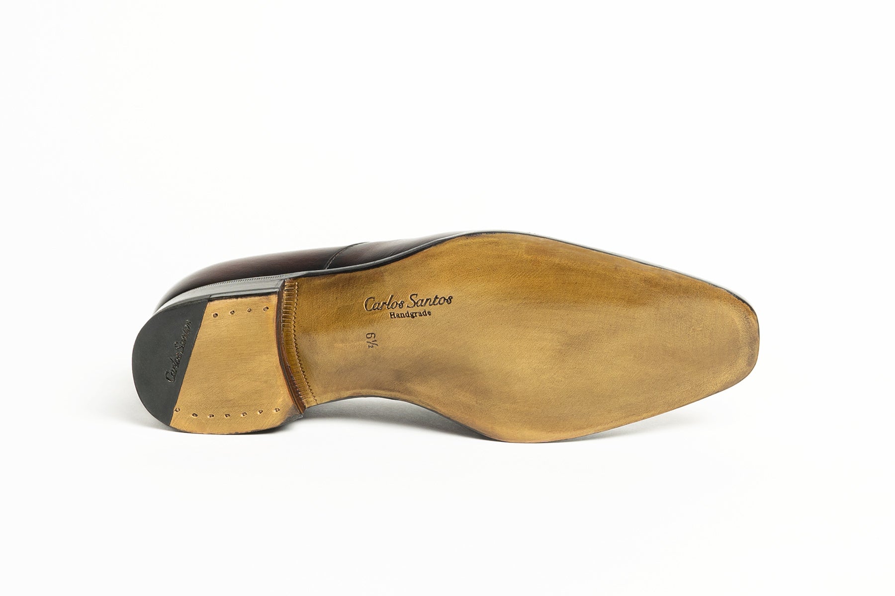 Sole view of Carlos Santos CS113 Handgrade Austerity Brogue Loafers in Bordo Shadow Patina with leather construction.